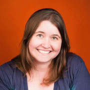 shevaun headshot red background